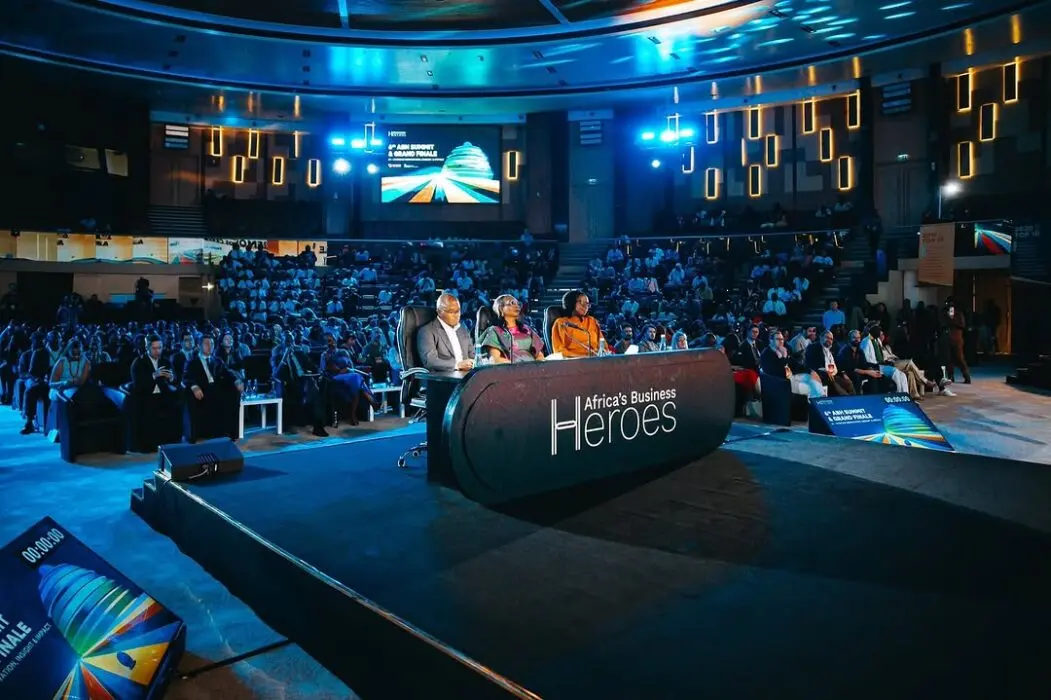 Africa's Business Heroes 2025 grand finale event with judges on stage and a large audience in attendance.