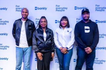 Picture with backdrop of Bankly and team to showcase story of Bankly's acquisition
