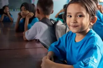A girl child wearing branded UNICEF T-shirts depicting UNICEF Venture Fund opportunity for chldren-focused innovators