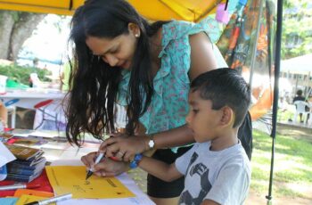 Positive engagement with children at SMEPEAKS outdoor event, promoting community outreach and development programmes.