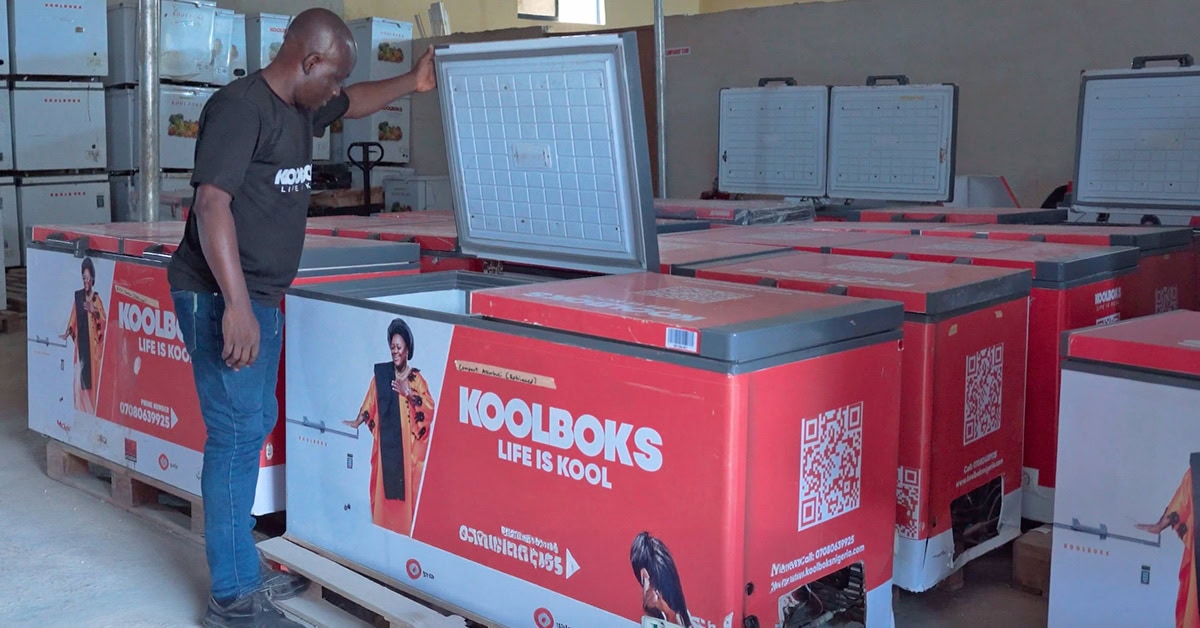 Koolboks raises $11m - image of man opening a Koolboks solar freezer